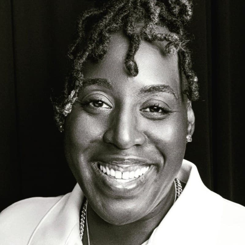 Portrait of Bianca D. McCall, LMFT, Founder and President of Desert Rose Gives. Black and white editorial photograph.